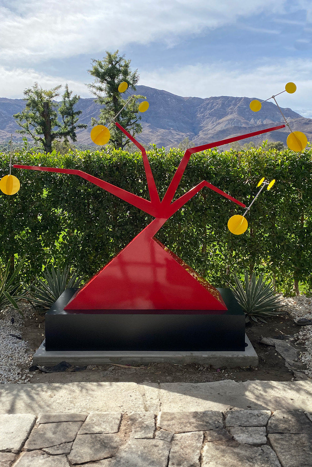 red contemporary outdoor sculpture in palm springs golf course