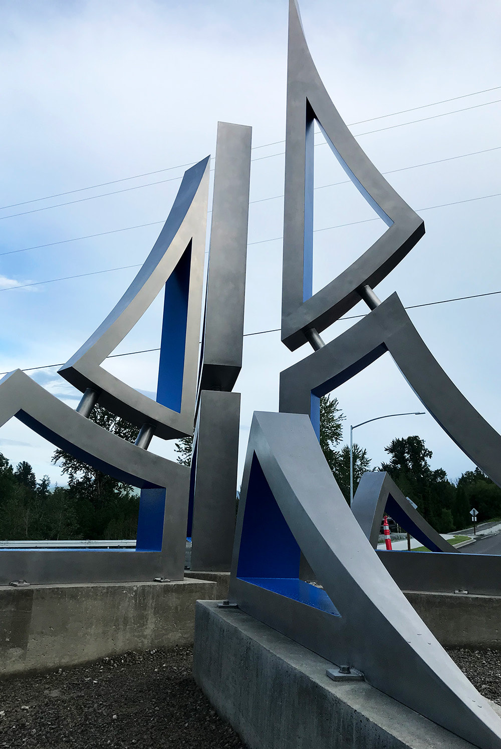 angled photo of a roundabout sculpture that is in the shape of a star and mountain