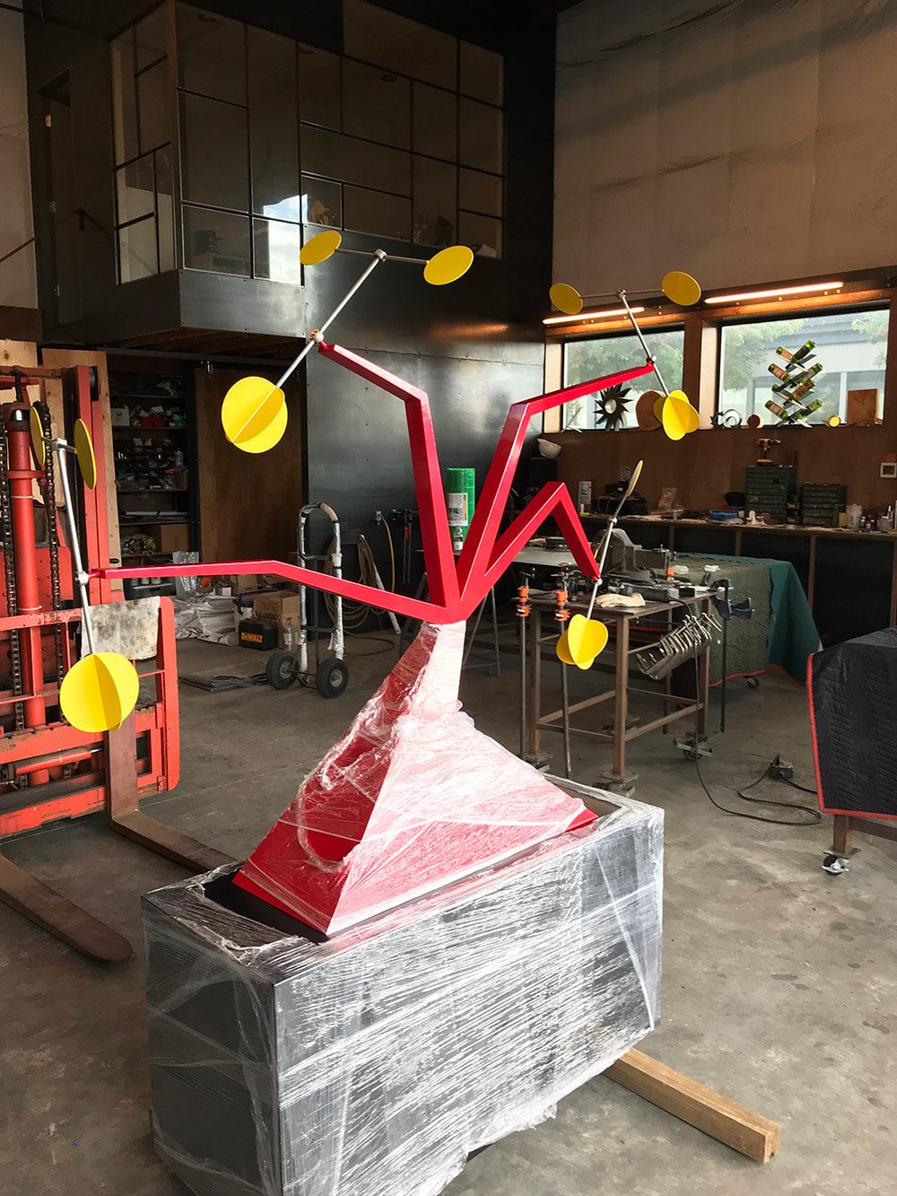 large modern sculpture in studio being shipped
