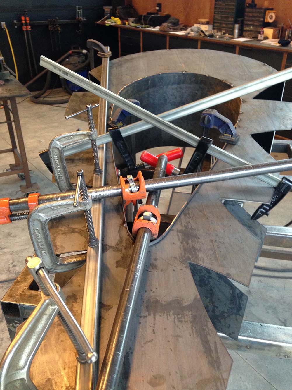 fabrication of a westhering steel sculpture in a art studio
