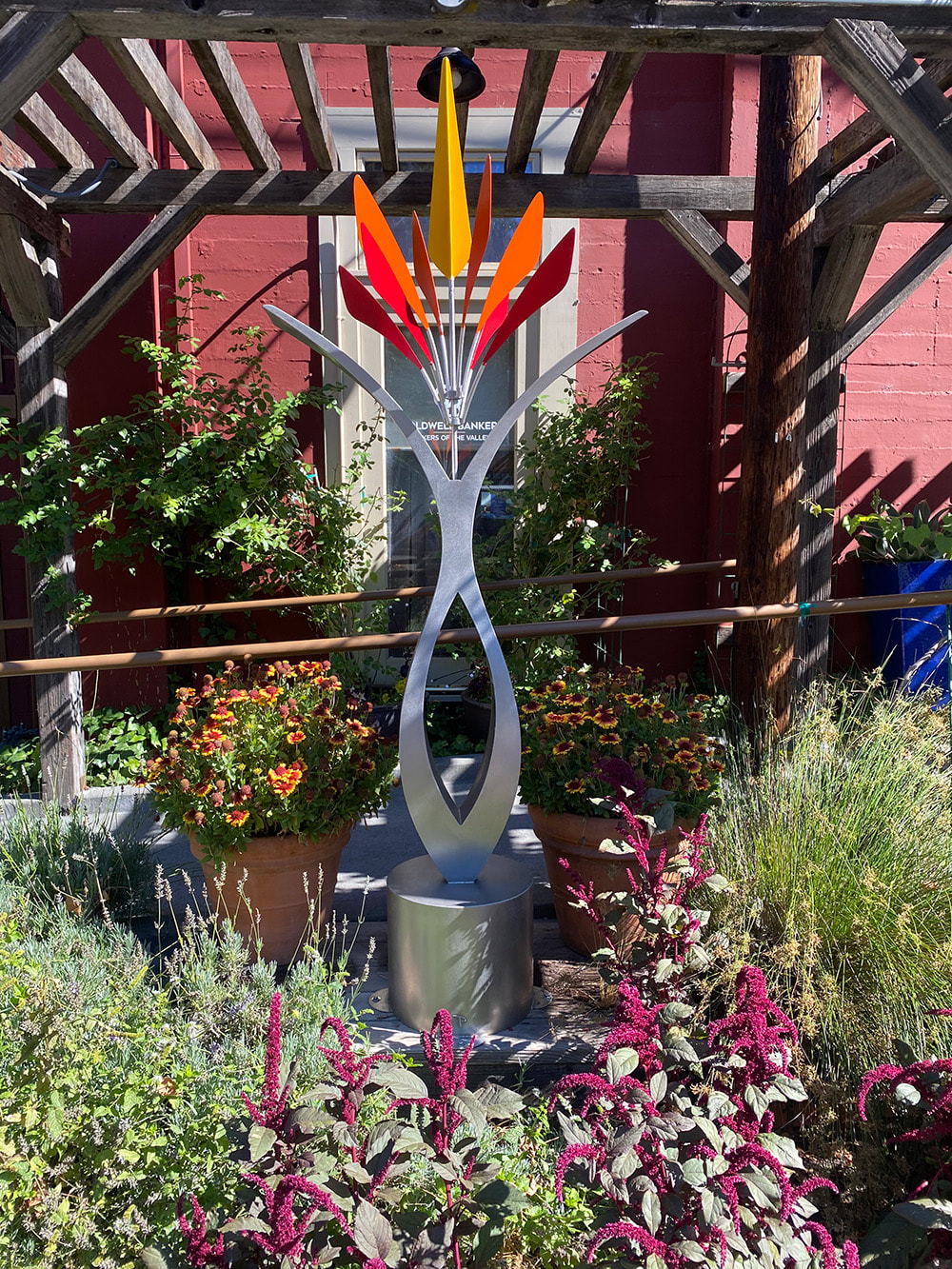 modern colorful kinetic sculpture in a garden in glen ellen