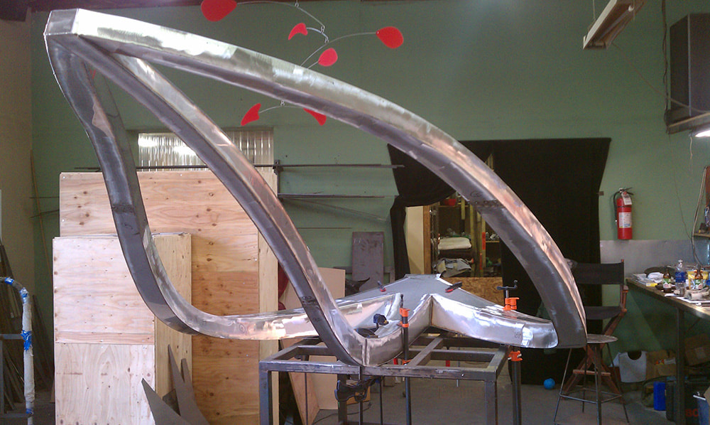 fabrication of stainless steel sculpture in a studio